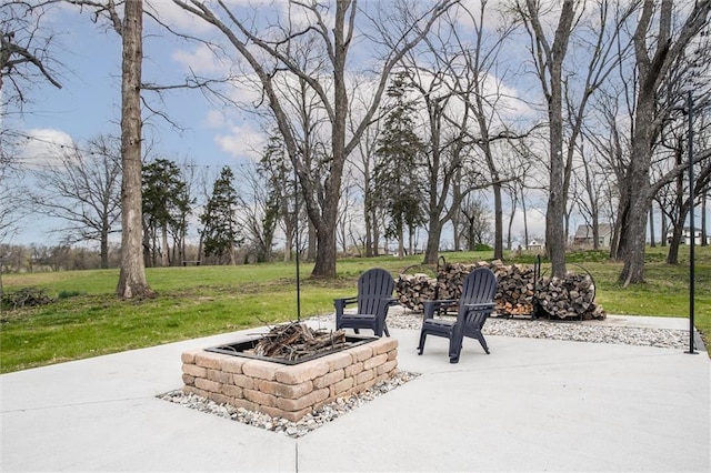 view of patio / terrace featuring an outdoor fire pit