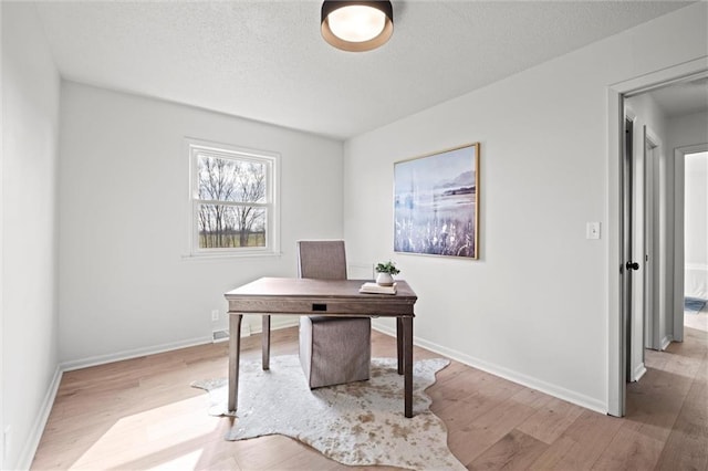 14875 Edgerton Rd, Gardner, KS 66030 - office area featuring light wood-style floors and a textured ceiling