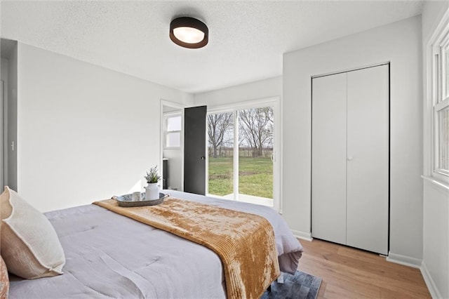 14875 Edgerton Rd, Gardner, KS 66030 - bedroom featuring light wood-type flooring and baseboards