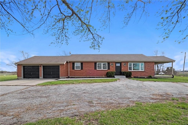 14875 Edgerton Rd, Gardner, KS 66030 - single story home featuring concrete driveway, an attached garage, and brick siding