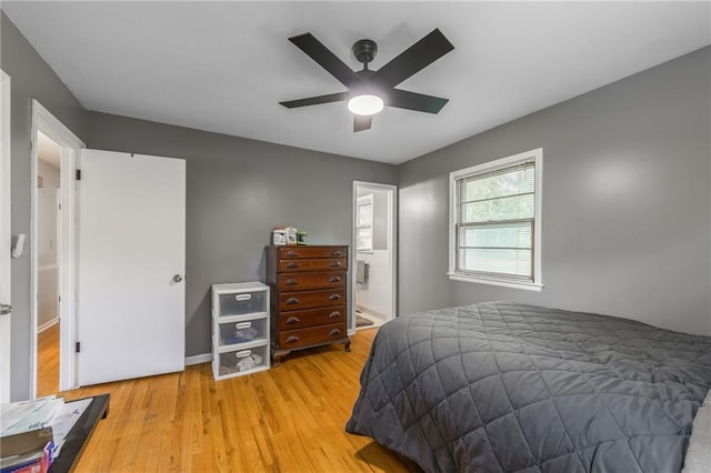 7201 E 130th Ter, Grandview, MO 64030 - bedroom with light wood finished floors and ceiling fan
