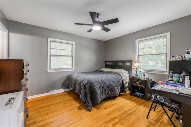 7201 E 130th Ter, Grandview, MO 64030 - bedroom featuring light wood-type flooring and a ceiling fan
