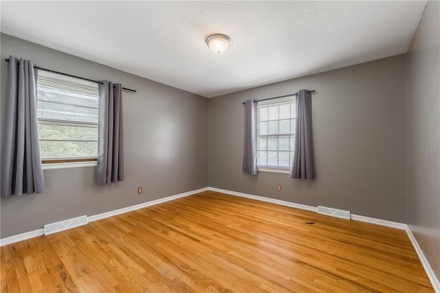 7201 E 130th Ter, Grandview, MO 64030 - empty room with light wood-type flooring and baseboards