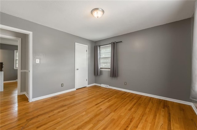 7201 E 130th Ter, Grandview, MO 64030 - empty room featuring light wood finished floors