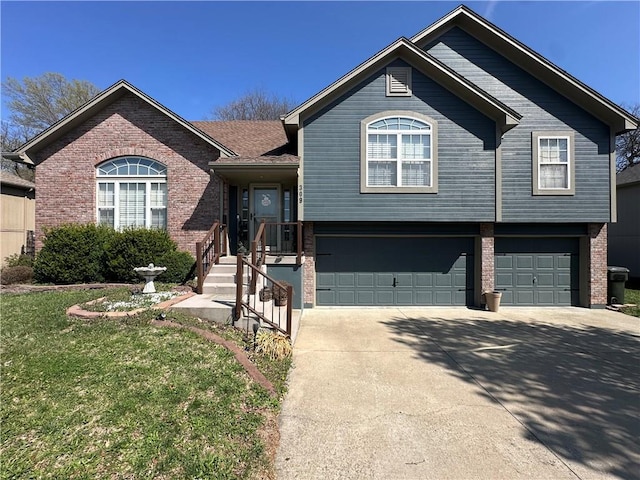 view of front of property with concrete driveway, a front lawn, brick siding, and a garage