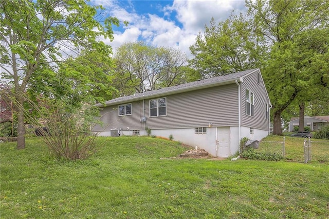 rear view of house with a yard