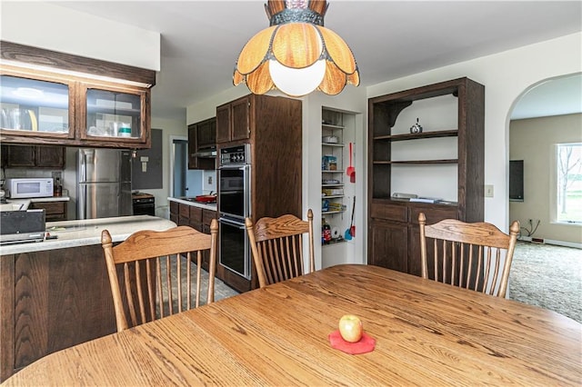 16468 K 16 Hwy, Oskaloosa, KS 66066 - carpeted dining space with arched walkways