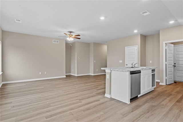 37839 W 207th Ter, Edgerton, KS 66021 - kitchen with dishwasher, a ceiling fan, a center island with sink, light wood-style flooring, and white cabinets