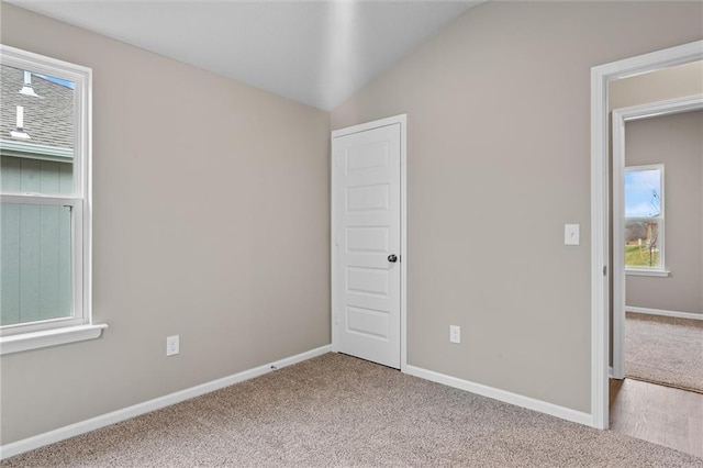 37839 W 207th Ter, Edgerton, KS 66021 - spare room with healthy amount of natural light, carpet, and vaulted ceiling