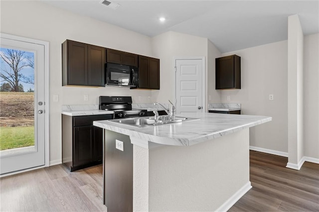 37854 W 207th Ter, Edgerton, KS 66021 - kitchen featuring black appliances, plenty of natural light, light wood-type flooring, and recessed lighting