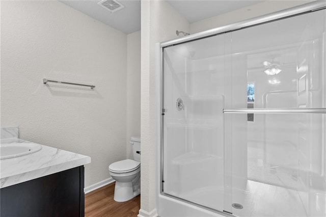 37854 W 207th Ter, Edgerton, KS 66021 - bathroom featuring a shower with shower door, wood finished floors, and vanity