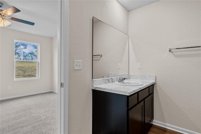 37854 W 207th Ter, Edgerton, KS 66021 - bathroom with vanity, ceiling fan, and a textured wall