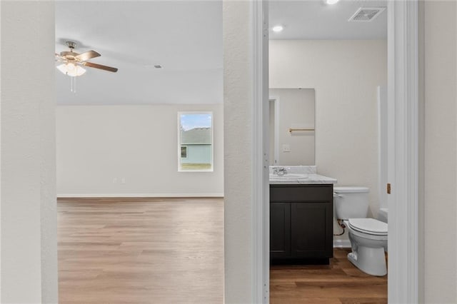 37854 W 207th Ter, Edgerton, KS 66021 - bathroom featuring wood finished floors, ceiling fan, and vanity
