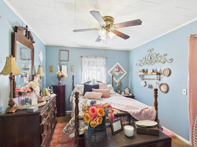 bedroom featuring baseboards, ornamental molding, and dark wood-type flooring