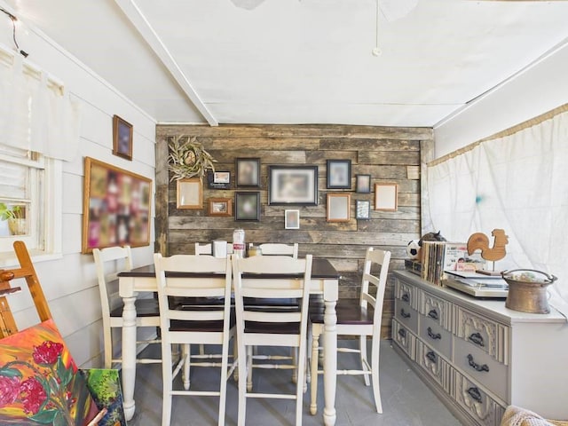 dining area with wooden walls