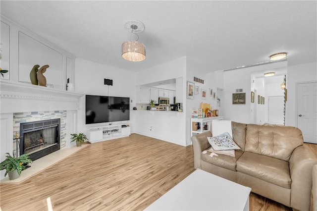 8218 NW Bradford Ct, Kansas City, MO 64151 - living area featuring visible vents, light wood-style floors, and a fireplace