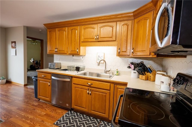 11295 County Road 366, Savannah, MO 64485 - kitchen featuring backsplash, light countertops, a sink, and appliances with stainless steel finishes