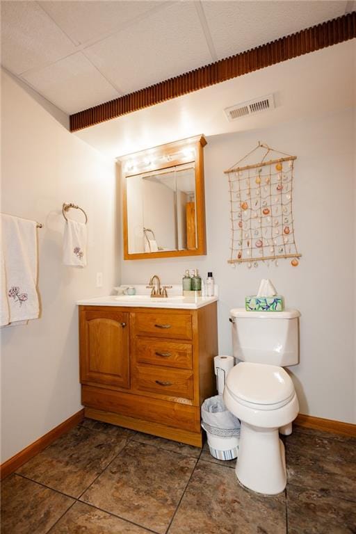 11295 County Road 366, Savannah, MO 64485 - bathroom featuring toilet, vanity, baseboards, and visible vents