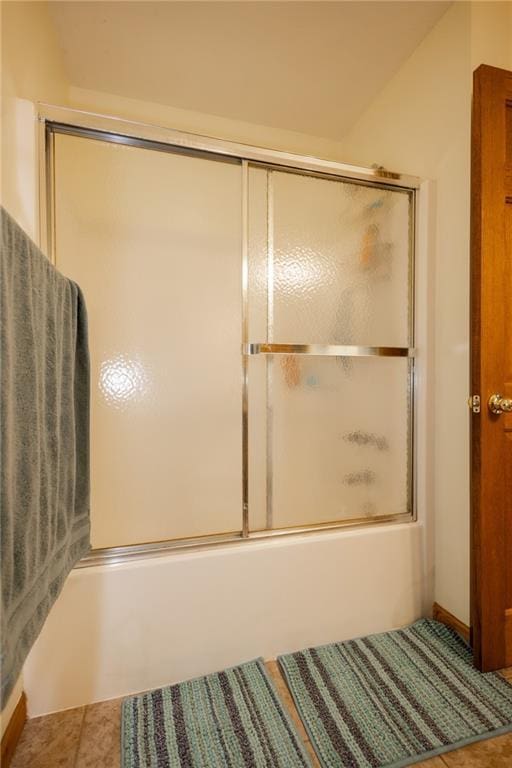 11295 County Road 366, Savannah, MO 64485 - bathroom featuring tile patterned floors and bath / shower combo with glass door