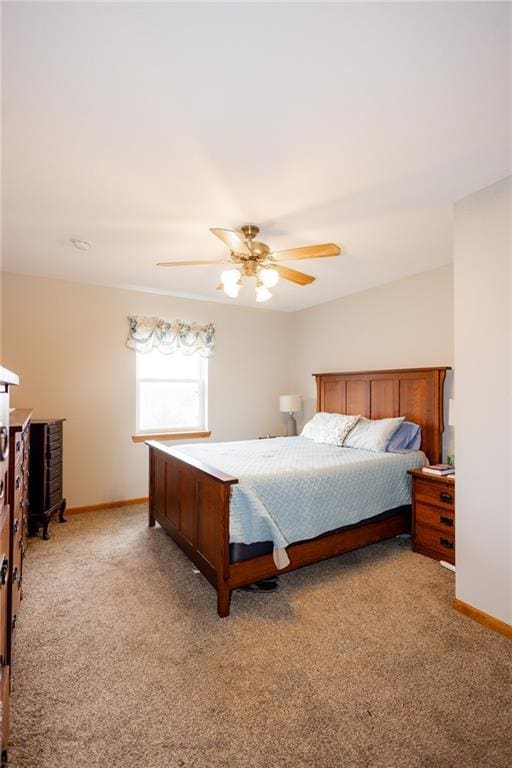11295 County Road 366, Savannah, MO 64485 - bedroom with baseboards, a ceiling fan, and light colored carpet