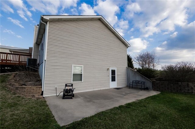 11295 County Road 366, Savannah, MO 64485 - back of property with central AC unit, a wooden deck, a patio, and a yard