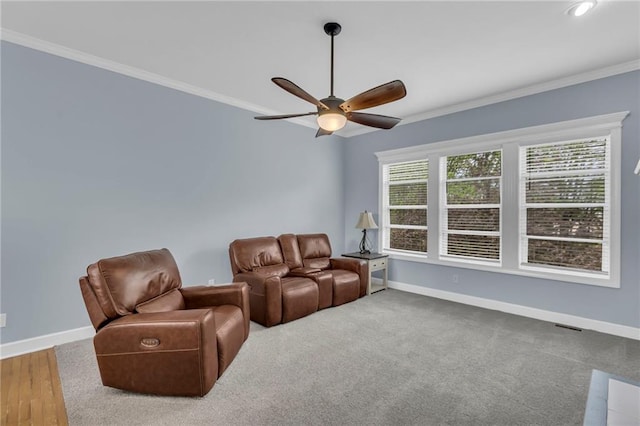 living area featuring baseboards and ornamental molding