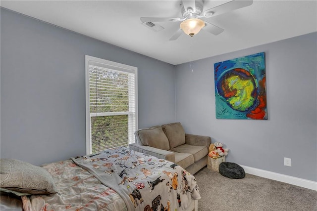 bedroom with carpet floors, baseboards, a ceiling fan, and visible vents