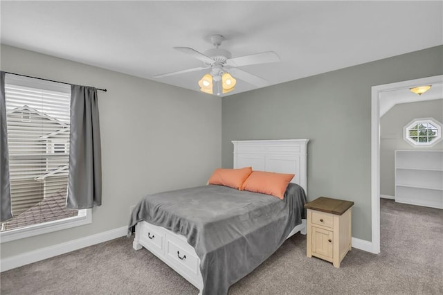 bedroom featuring baseboards, ceiling fan, and light carpet