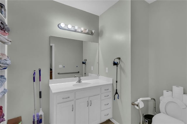 bathroom with vanity and toilet