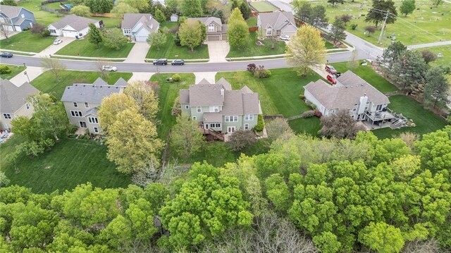 birds eye view of property with a residential view