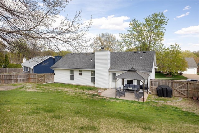 back of house with a fenced backyard, a patio, a lawn, and outdoor lounge area