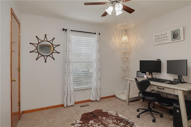 home office featuring carpet floors, a ceiling fan, baseboards, and visible vents