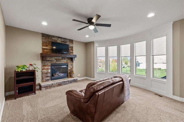 11194 S Hastings St, Olathe, KS 66061 - living room with a ceiling fan, visible vents, carpet, and a fireplace