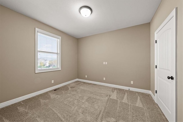 11194 S Hastings St, Olathe, KS 66061 - empty room with baseboards, carpet, and visible vents
