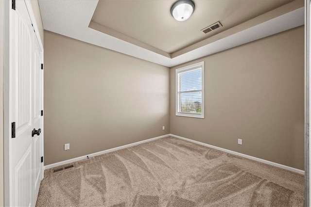 11194 S Hastings St, Olathe, KS 66061 - carpeted empty room featuring baseboards, a tray ceiling, and visible vents