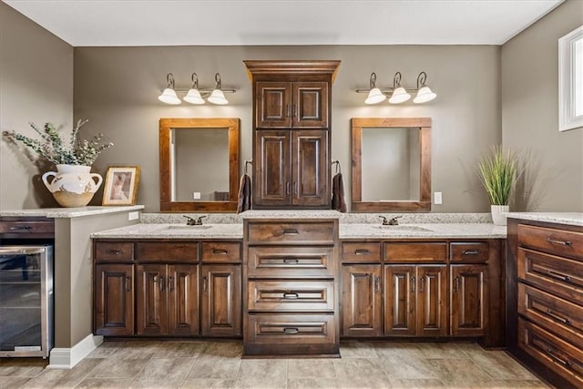 11194 S Hastings St, Olathe, KS 66061 - bathroom featuring beverage cooler, double vanity, and a sink