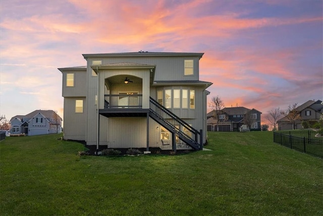 11194 S Hastings St, Olathe, KS 66061 - back of property featuring stairs, ceiling fan, a lawn, and fence