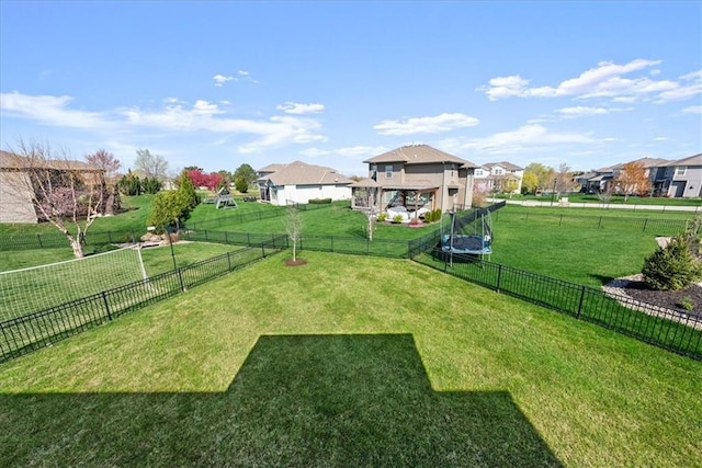 11194 S Hastings St, Olathe, KS 66061 - view of yard featuring a fenced backyard, a trampoline, and a residential view