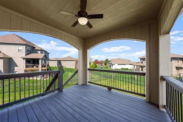 11194 S Hastings St, Olathe, KS 66061 - wooden deck with ceiling fan, a yard, and a residential view