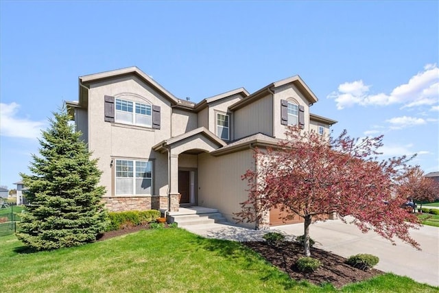 11194 S Hastings St, Olathe, KS 66061 - traditional home featuring a garage, stone siding, and a front yard