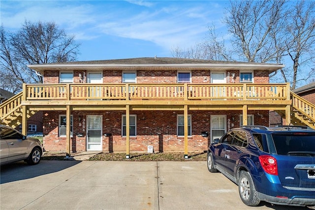 3552 S Lynn St, Independence, MO 64055 - view of property featuring stairs and brick siding