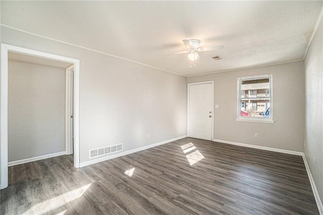 3552 S Lynn St, Independence, MO 64055 - spare room with baseboards, visible vents, wood finished floors, and ceiling fan