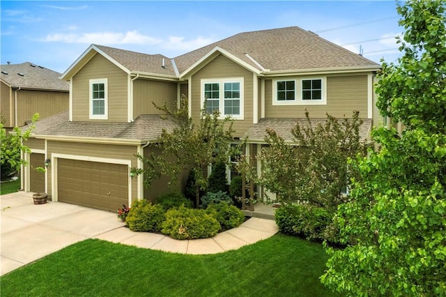 view of front of home with a garage, a front lawn, roof with shingles, and driveway