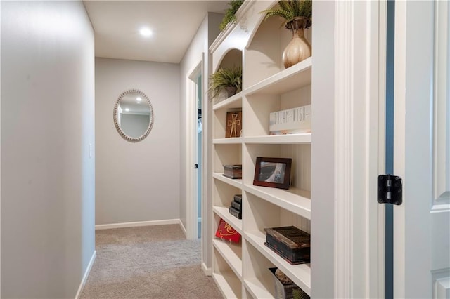 hall with carpet flooring and baseboards