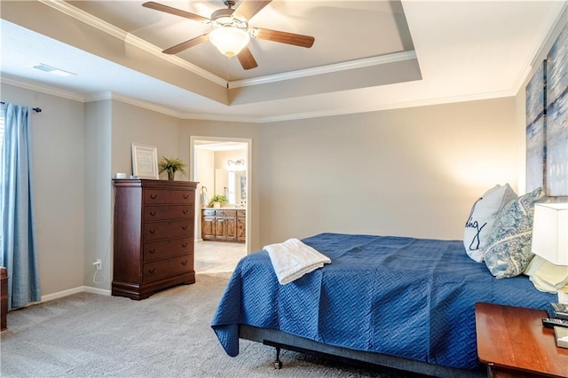 bedroom featuring ornamental molding, light carpet, baseboards, connected bathroom, and a raised ceiling