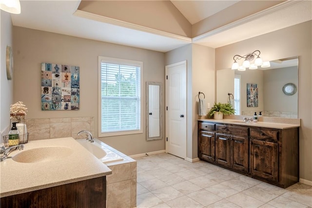 full bathroom with vaulted ceiling, two vanities, a sink, and a bath