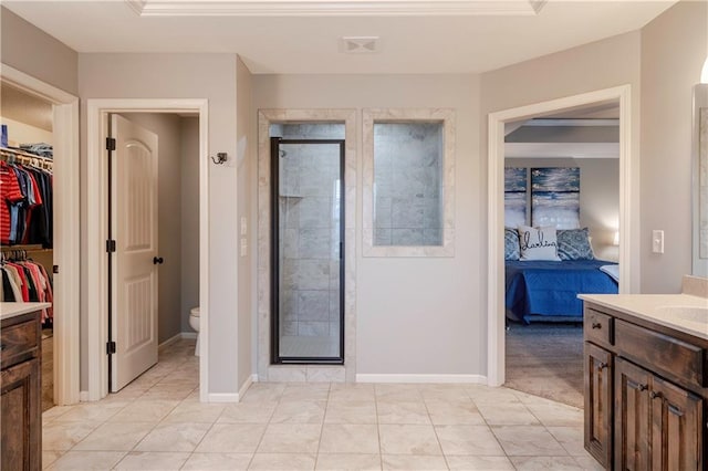 full bathroom with vanity, toilet, tile patterned floors, a shower stall, and visible vents