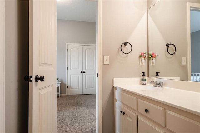 bathroom featuring vanity and baseboards