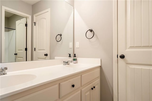 bathroom with double vanity and a sink