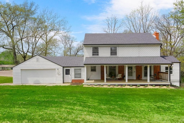 country-style home with an attached garage, roof with shingles, and a front yard